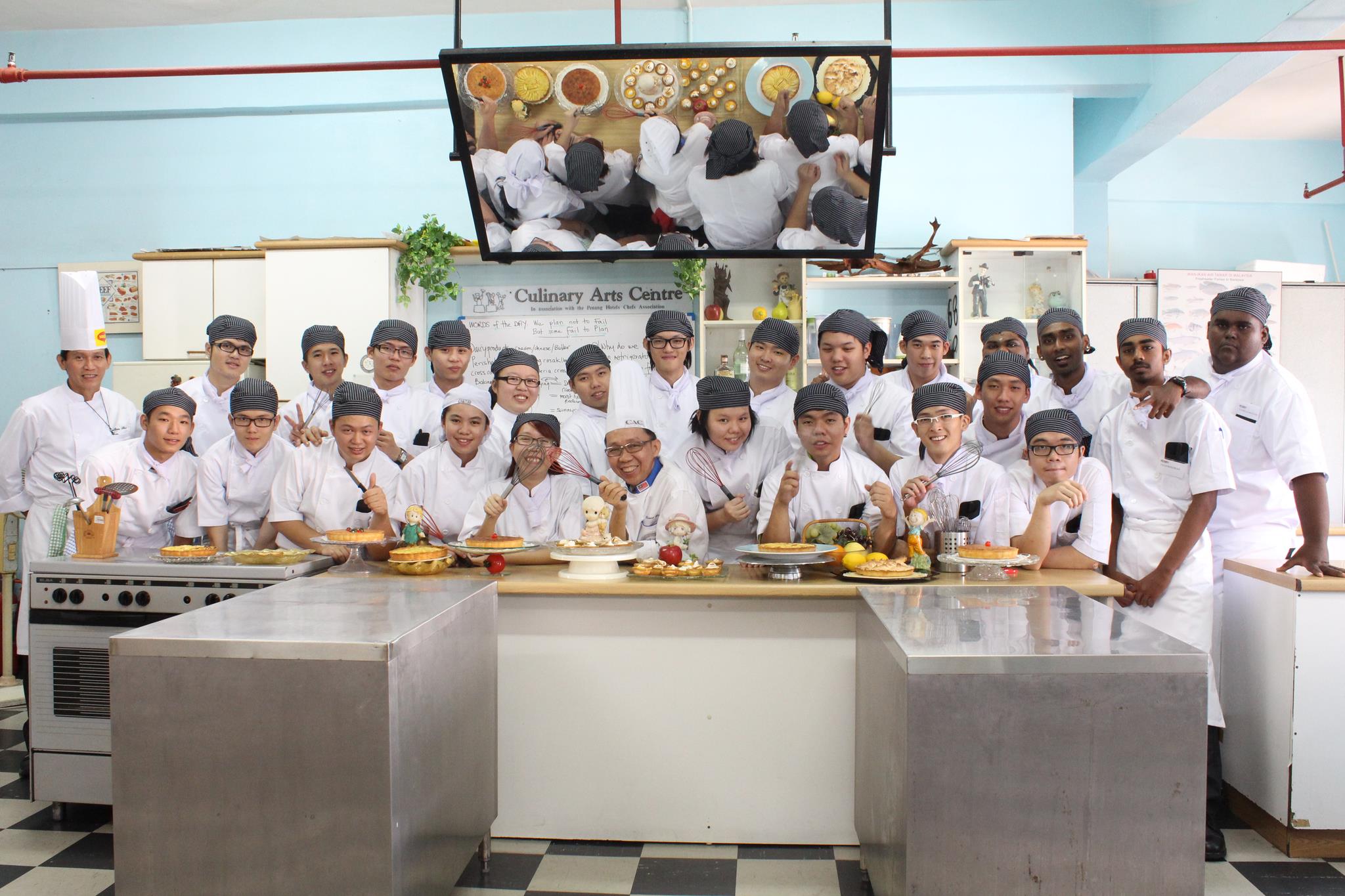 CAC Academy of Chefs — Principal Chef Bruce Lee with student Ying (hero; replace with new group photo when available)